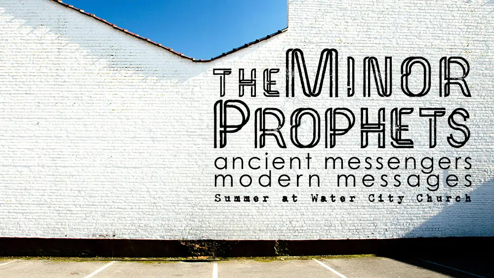 White brick wall with the logo for the Minor Prophets series.